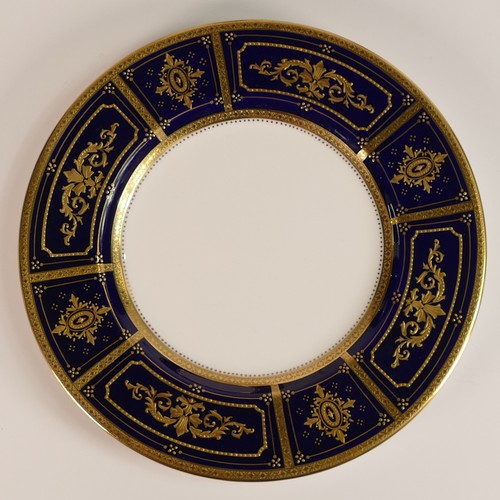 240 - Minton, six heavily gilt plates. One 23cm heavily gilt with Cobalt ground border and elaborate raise... 