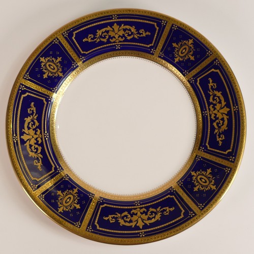 240 - Minton, six heavily gilt plates. One 23cm heavily gilt with Cobalt ground border and elaborate raise... 