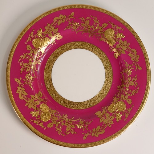 241 - Minton, seven heavily gilt plates. In red and light blue grounds with elaborate raised gilt patterns... 