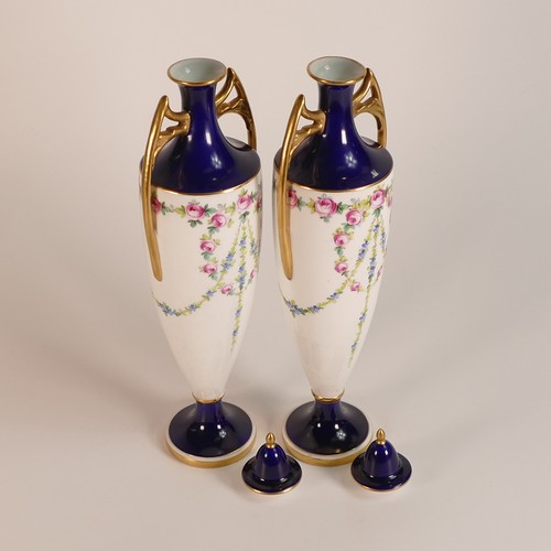 260 - Minton, pair of hand painted twin handled vase and covers. Painted with rose swags on white. Cobalt ... 