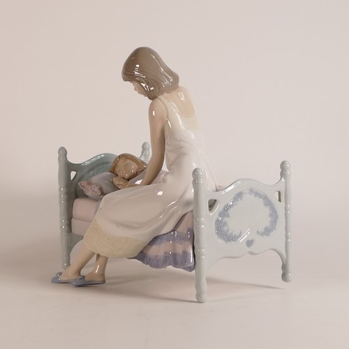 265 - Lladro, Sleep Tight modelled as a mother putting her daughter to bed. Height: 20cm. Boxed.