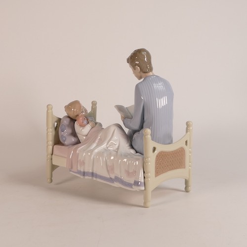 268 - Lladro, Just One More 5899. Modelled as a Father reading stories to Son. Boxed. Height: 22cm