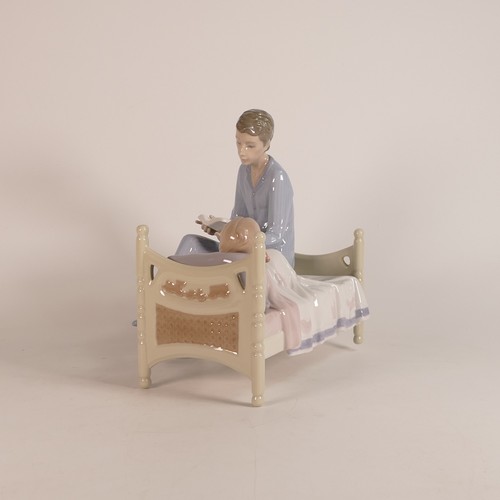 268 - Lladro, Just One More 5899. Modelled as a Father reading stories to Son. Boxed. Height: 22cm