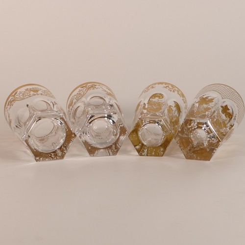 284 - De Lamerie, four heavily gilt crystal glass tumblers. Height of tallest: 13.5cm (4)