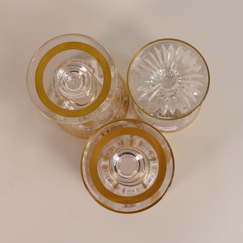 285 - De Lamerie, three heavily gilt crystal glasses. Height of tallest: 14.5cm (3)