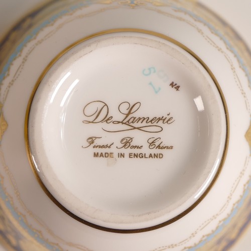 292 - De Lamerie Fine Bone China, nineteen porcelain tea bowls. Sixteen with light blue ground and gilt pa... 