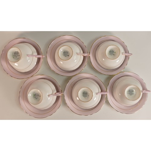 295 - Paragon, a set of six hand painted tulip tea cups and saucers. (6)