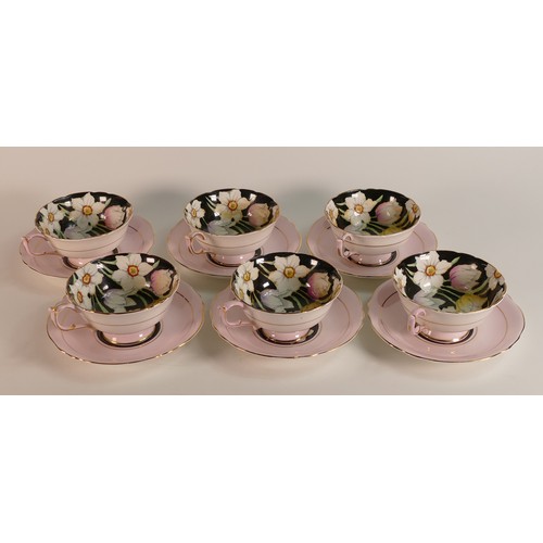 295 - Paragon, a set of six hand painted tulip tea cups and saucers. (6)