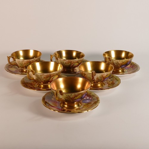 298 - Aynsley, Orchard Gold pattern tea cups. Six tea cups and six saucers. Signed by D Jones and N Brunt.... 