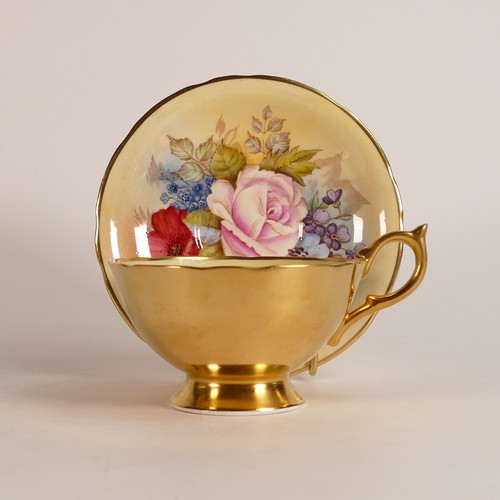 314 - J. A. Bailey for Aynsley, Porcelain tea cup and saucer with interior cabbage rose to cup and saucer.