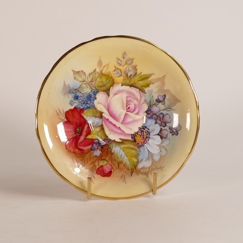 314 - J. A. Bailey for Aynsley, Porcelain tea cup and saucer with interior cabbage rose to cup and saucer.