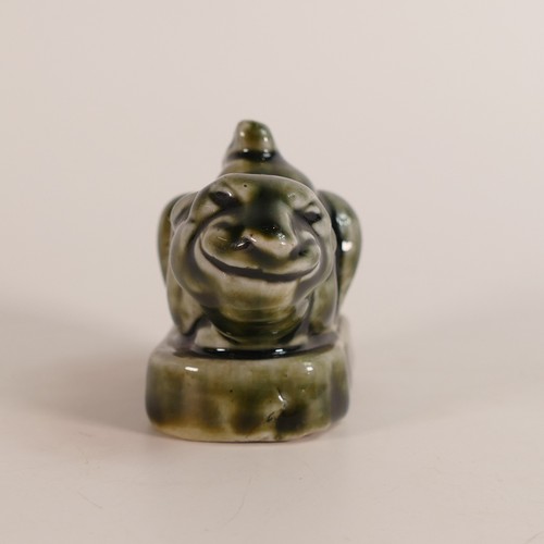 473 - Mark V Marshall for Royal Doulton, model of the Cheshire Cat in mottled green glaze. Height: 6cm