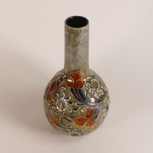 580 - Frank A. Butler for Doulton Lambeth, 
bottle form vase with tube lined scrolling foliate embossed de... 