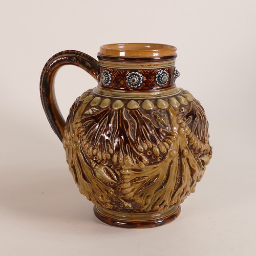 590 - Doulton lambeth ewer decorated all around with embossed seaweed and sea shells, h.17cm.