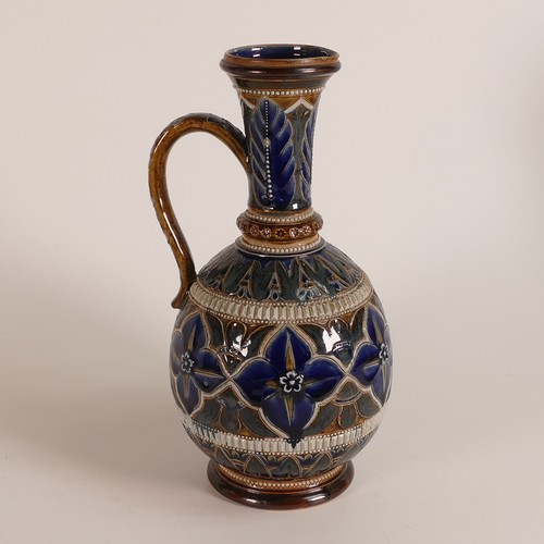 593 - Elizabeth Fisher for Doulton Lambeth, a ewer decorated with incised flower heads and leaves on blue ... 