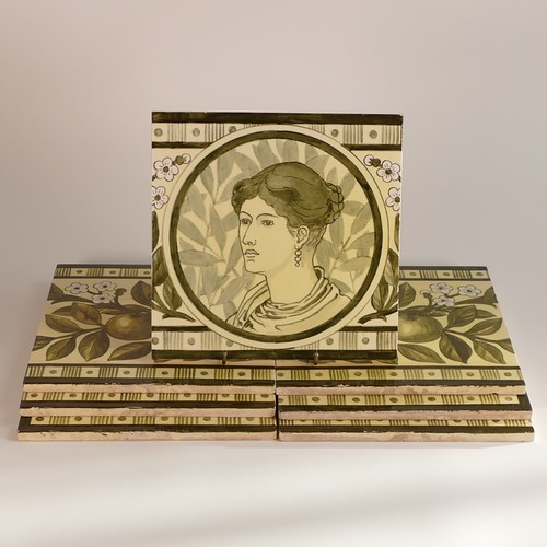 612 - Doulton Lambeth, Arts & Crafts period set of seven monochromatic green earthenware wall tiles. Centr... 