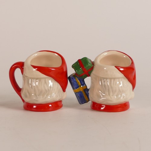 677 - Royal Doulton, four tiny character jugs Santa Claus D7060, 'Santa Claus' D6950, 'Santa Claus' D7020,... 