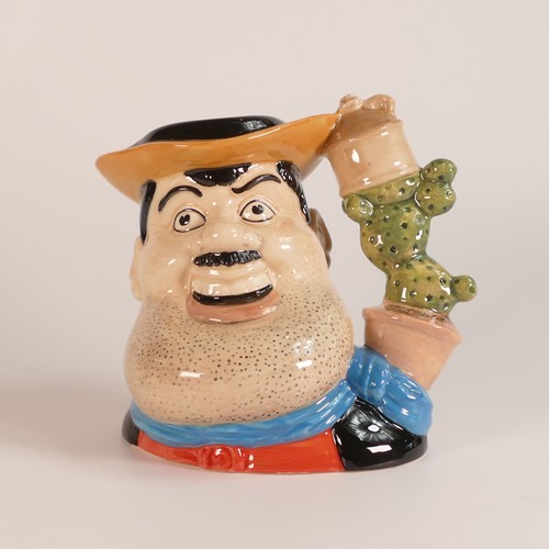 719 - Royal Doulton, two Desperate Dan character jugs. One large, D7006 together with intermediate D7034. ... 