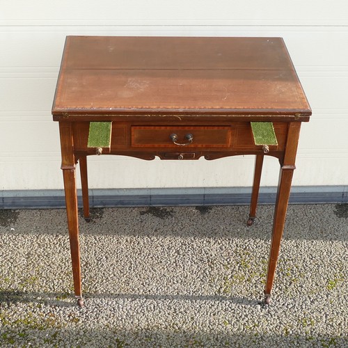 802 - Edwardian inlaid Mahogany fold over games table. Pull out pegboard and table supports. Shaped apron ... 