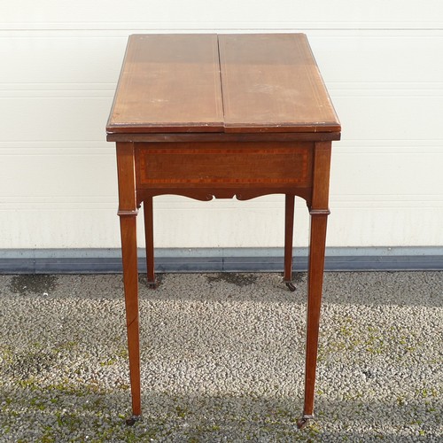 802 - Edwardian inlaid Mahogany fold over games table. Pull out pegboard and table supports. Shaped apron ... 