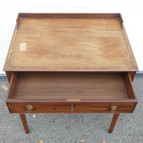 815 - Victorian Writing table with central locking drawer. Rectangular top, low gallery to back with stepp... 