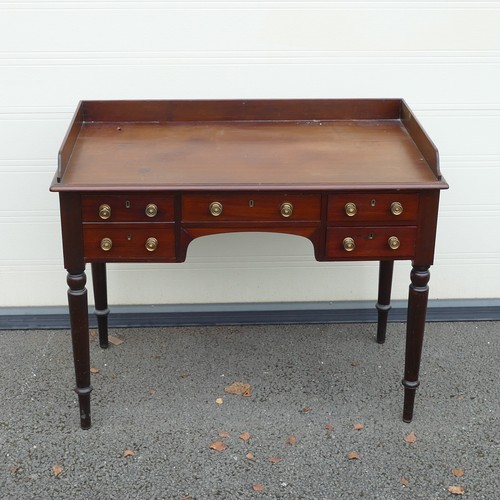 816 - Victorian Writing desk. Surrounding gallery on rectangular top with sloping edge, five drawers below... 