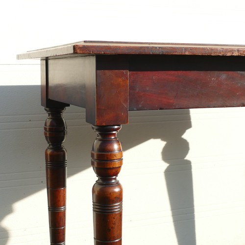 822 - Late Victorian leather topped writing table. On four turned supports terminating on brass and cerami... 