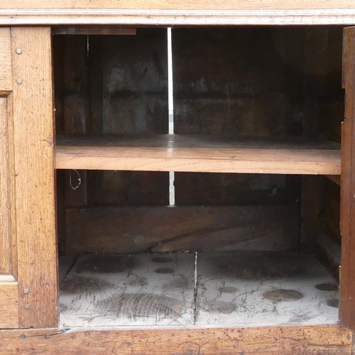 826 - Georgian large Oak dresser. Of panel construction with three upper drawers over two lower cupboards.... 