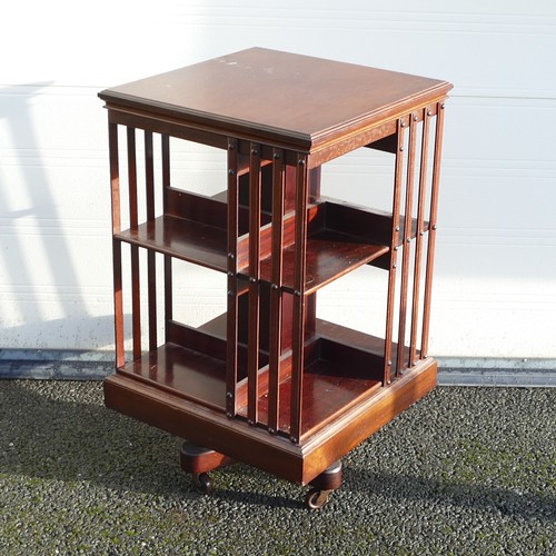 838 - Early 20th century revolving Library Bookcase. Cast iron base and castors with indistinct makers nam... 