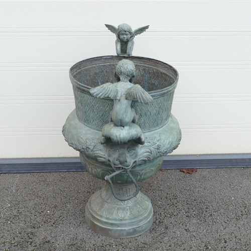 842 - 20th century Bronze garden Urn, cast with twin cherubs facing inwards and loop handles held by lions... 