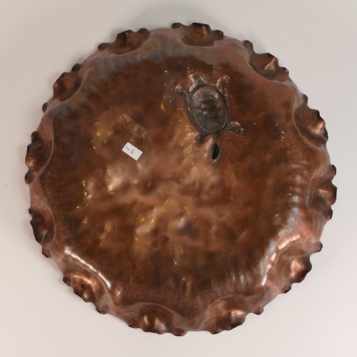 850 - Hand beaten copper dish containing a model of a turtle. (D: 33cm)