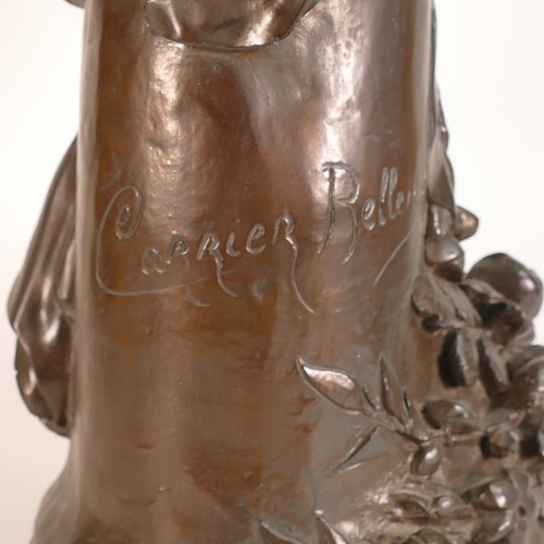 856 - After Albert-Ernest Carrier-Belleuse (1824-1887) A Bronzed figure of a semi-nude female figure clutc... 