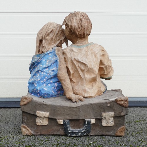 906 - Phillip Cox (English, b.1945-) A card and Papiermâché sculpture of two children reading Pinocchio sa... 