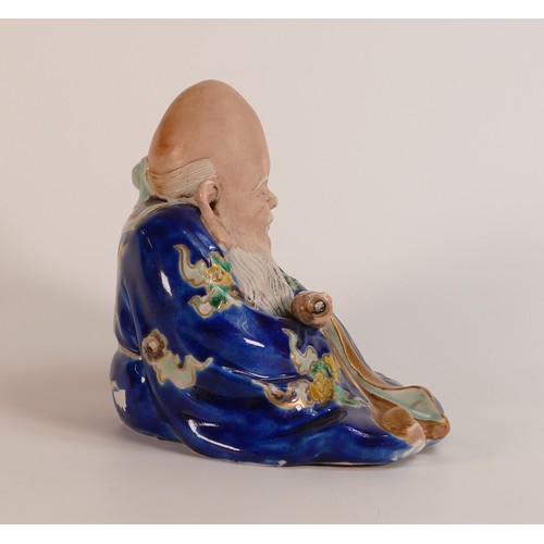 1086 - Republic Period (1911-1949) porcelain figure depicting seated Chinese deity Shou Lai. Decorated vivi... 