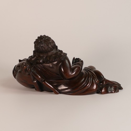 1112 - Chinese carved hardwood figure of reclining Buddha with mythical horned beast under his left arm. My... 