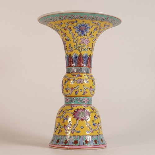 1114 - 20th century Cantonese yellow ground Gu form vase. Vibrant polychrome enamels including blue to inte... 