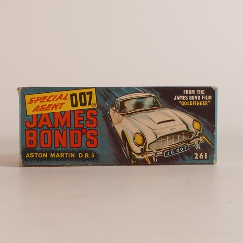 1124 - Corgi, 261 James Bond 007 Aston Martin D.B.5. In original box with display stand and 'secret instruc... 