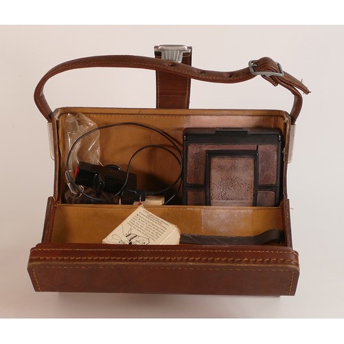 1127 - Polaroid SX-70 Land Camera Model 2 in original leather fitted case with accessories and ephemera.