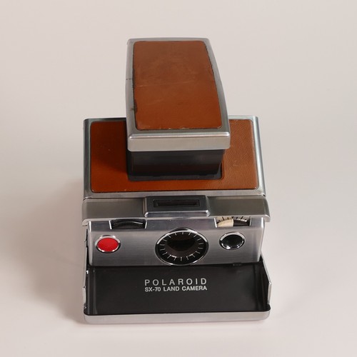 1154 - Polaroid SX-70 Land Camera. Chrome and tan covering. Includes original inserts. In Keystone leather ... 