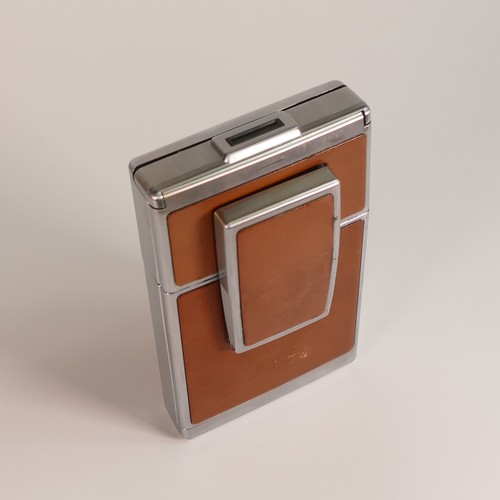 1154 - Polaroid SX-70 Land Camera. Chrome and tan covering. Includes original inserts. In Keystone leather ... 