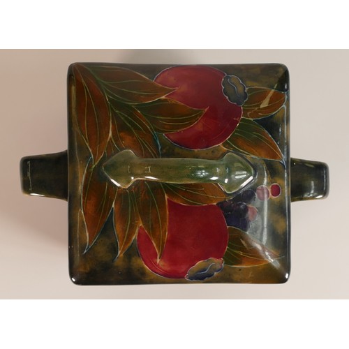 1198 - William Moorcroft two handled Biscuit Barrel & cover, in the Arts & Crafts pomegranate design, c1915... 