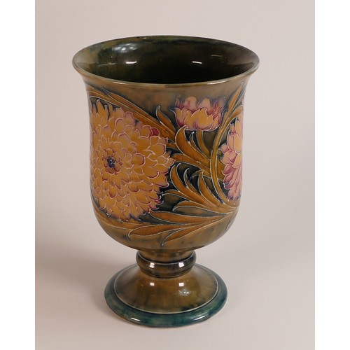 1200 - William Moorcroft chalice decorated in the Cornflower design on ochre ground, C1915, h.20.5cm. a/f