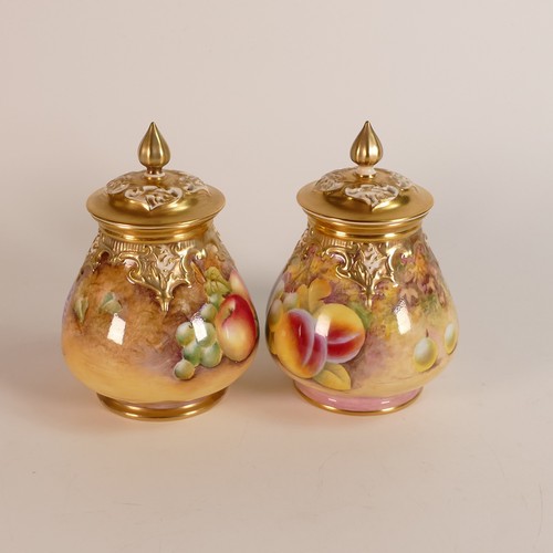 1270 - A pair of Royal Worcester Potpourri jars & covers, gilded and hand painted with fruit, one signed J ... 