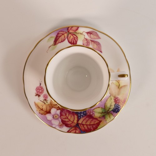 1278 - Royal Worcester gilded coffee can & saucer, decorated with fruit.