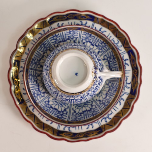 1296 - Royal Worcester, Royal Lily pattern trio together with a shallow bowl. Diameter of bowl: 20cm