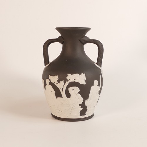 1352 - Wedgwood, black Jasperware Portland vase. Impressed Wedgwood marks and dated 1989. Height: 14.5cm