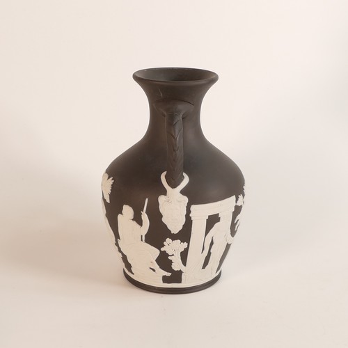 1352 - Wedgwood, black Jasperware Portland vase. Impressed Wedgwood marks and dated 1989. Height: 14.5cm