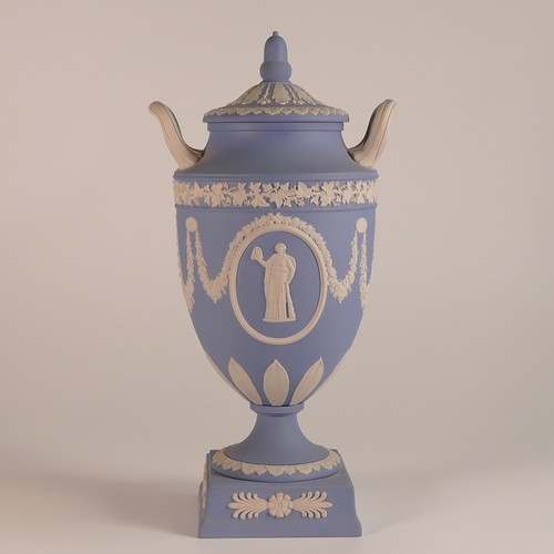 1387 - Wedgwood, blue Jasperware twin handled lidded urn. acorn finial moulded lid. Impressed 'Wedgwood' ma... 