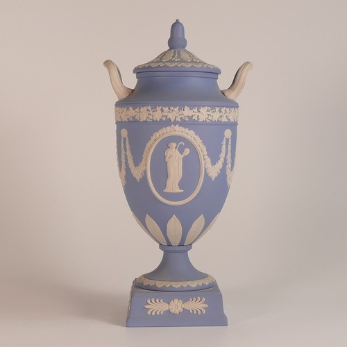 1387 - Wedgwood, blue Jasperware twin handled lidded urn. acorn finial moulded lid. Impressed 'Wedgwood' ma... 