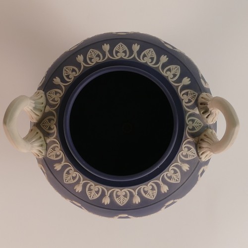 1388 - Wedgwood, dark blue Jasperware two handled urn & cover, classical relief scene to body. Impressed 'W... 